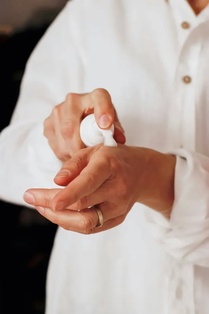 Applying a thin layer of ruxolitinib cream